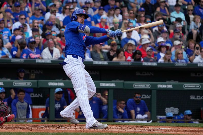 Mar 26, 2024; Mesa, Arizona, USA; Chicago Cubs centerfielder Cody Bellinger (24) hits against the St. Louis Cardinals in the first inning at Sloan Park. Mandatory Credit: Rick Scuteri-USA TODAY Sports