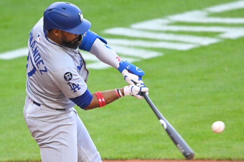 May 26, 2025; Cleveland, Ohio, USA; Los Angeles Dodgers right fielder Teoscar Hernandez (37) hits an RBI single in the fifth inning against the Cleveland Guardians at Progressive Field. Mandatory Credit: David Richard-Imagn Images