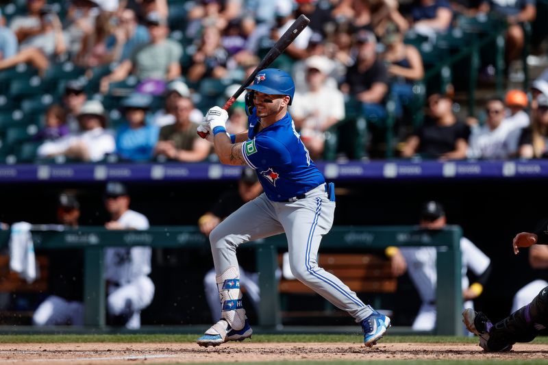 Sep 3, 2023; Denver, Colorado, USA; Toronto Blue Jays first baseman Spencer Horwitz (48) watches his ball on an RBI single in the fifth inning against the Colorado Rockies at Coors Field. Mandatory Credit: Isaiah J. Downing-USA TODAY Sports