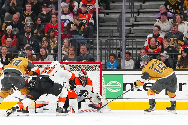 Jan 19, 2026; Las Vegas, Nevada, USA; Philadelphia Flyers goaltender Samuel Ersson (33) makes a save against Vegas Golden Knights right wing Pavel Dorofeyev (16) during the second period at T-Mobile Arena. Mandatory Credit: Stephen R. Sylvanie-Imagn Images