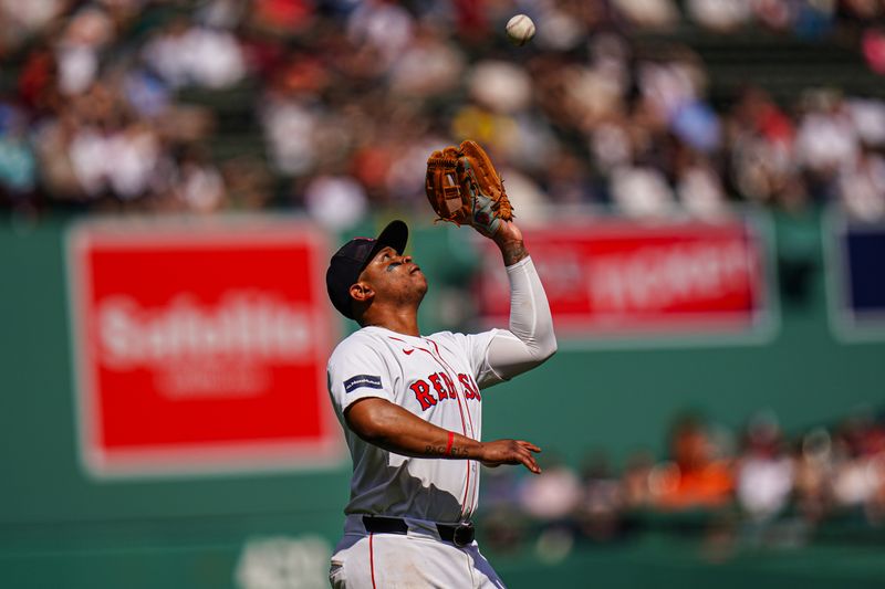 May 2, 2024; Boston, Massachusetts, USA; Boston Red Sox third baseman Rafael Devers (11) makes the play to retire the half against the San Francisco Giants in the sixth inning at Fenway Park. Mandatory Credit: David Butler II-USA TODAY Sports