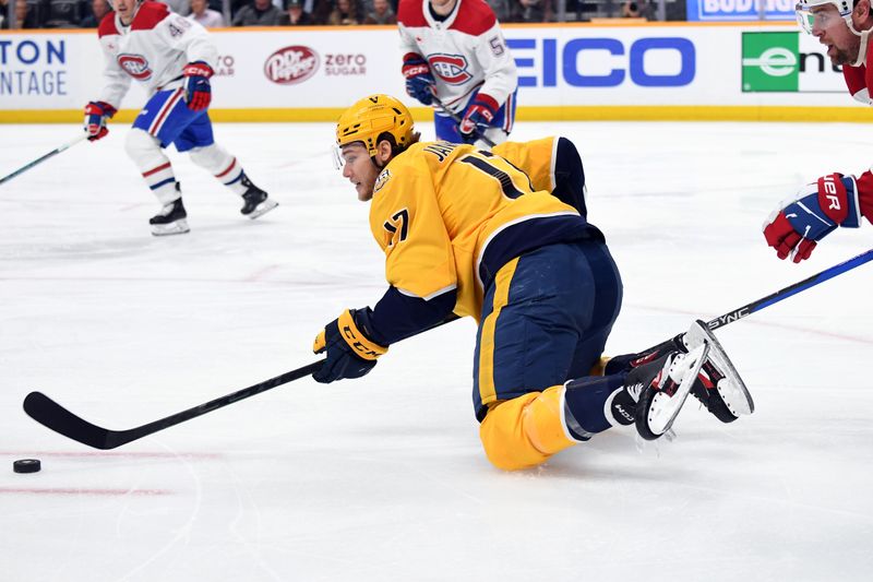 Mar 5, 2024; Nashville, Tennessee, USA; Nashville Predators center Mark Jankowski (17) handles the puck from his knees during the first period against the Montreal Canadiens at Bridgestone Arena. Mandatory Credit: Christopher Hanewinckel-USA TODAY Sports