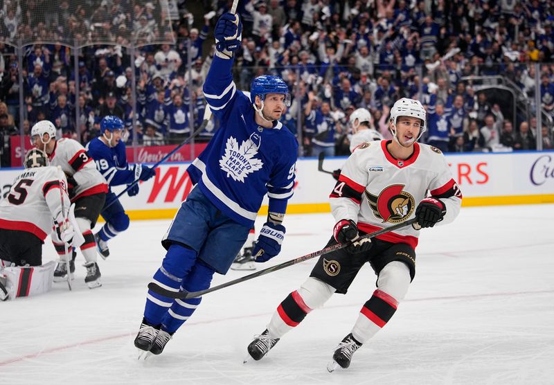 Apr 20, 2025; Toronto, Ontario, CAN; Toronto Maple Leafs defenceman Oliver Ekman-Larsson (95) celebrates his goal in front of Ottawa Senators forward Dylan Cozens (24)  during the first period of game one of the first round of the 2025 Stanley Cup Playoffs at Scotiabank Arena. Mandatory Credit: John E. Sokolowski-Imagn Images