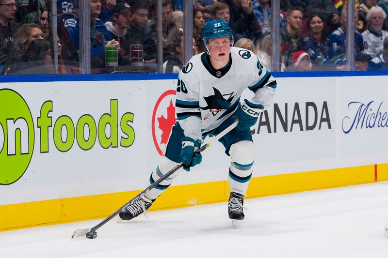 Dec 23, 2023; Vancouver, British Columbia, CAN; San Jose Sharks forward Fabian Zetterlund (20) handles the puck against the Vancouver Canucks in the second period at Rogers Arena. Mandatory Credit: Bob Frid-USA TODAY Sports