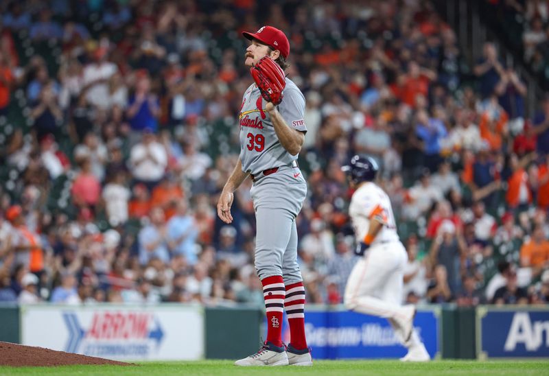 Jun 5, 2024; Houston, Texas, USA; St. Louis Cardinals starting pitcher Miles Mikolas (39) reacts and Houston Astros designated hitter Yainer Diaz (21) rounds the bases after hitting a home run during the fifth inning at Minute Maid Park. Mandatory Credit: Troy Taormina-USA TODAY Sports