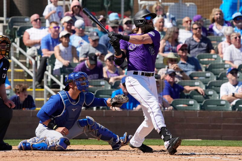 Mar 21, 2024; Salt River Pima-Maricopa, Arizona, USA; Colorado Rockies designated hitter Charlie Blackmon (19) hits a two run home run against the Chicago Cubs in the third inning at Salt River Fields at Talking Stick. Mandatory Credit: Rick Scuteri-USA TODAY Sports