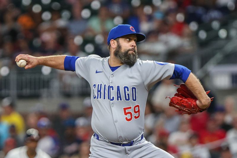Sep 9, 2025; Cumberland, Georgia, USA; Chicago Cubs pitcher Andrew Kittredge (59) pitches the ball against the Atlanta Braves during the seventh inning at Truist Park. Mandatory Credit: Jordan Godfree-Imagn Images