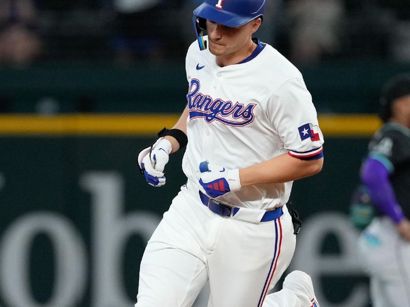 May 29, 2024; Arlington, Texas, USA;  Texas Rangers shortstop Corey Seager (5) circles the bases his two-run home run against the Arizona Diamondbacks during the fifth inning at Globe Life Field. Mandatory Credit: Jim Cowsert-USA TODAY Sports