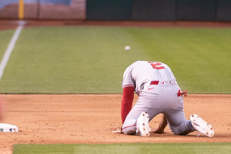 Jul 2, 2024; Oakland, California, USA; Los Angeles Angels third baseman Luis Rengifo (2) is unable to make the play during the sixth inning of the game against the Oakland Athletics at Oakland-Alameda County Coliseum. Mandatory Credit: Ed Szczepanski-USA TODAY Sports