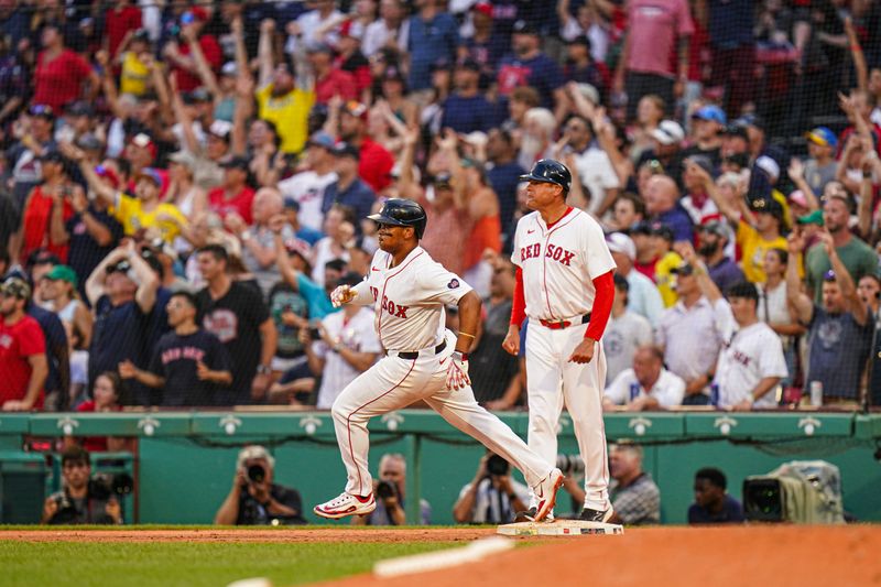 Jul 31, 2024; Boston, Massachusetts, USA; Boston Red Sox third baseman Rafael Devers (11) rounds the bases after hitting a double to center field to drive in the winning run against the Seattle Mariners in the tenth inning at Fenway Park. Mandatory Credit: David Butler II-USA TODAY Sports