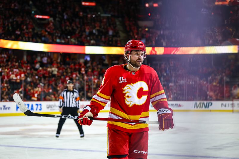 Dec 31, 2025; Calgary, Alberta, CAN; Calgary Flames defenseman Rasmus Andersson (4) scores a goal against the Philadelphia Flyers during the second period at Scotiabank Saddledome. Mandatory Credit: Sergei Belski-Imagn Images