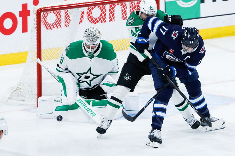 May 7, 2025; Winnipeg, Manitoba, CAN; Dallas Stars goalie Jake Oettinger (29) makes a save against the Winnipeg Jets during the third period in game one of the second round of the 2025 Stanley Cup Playoffs at Canada Life Centre. Mandatory Credit: Terrence Lee-Imagn Images
