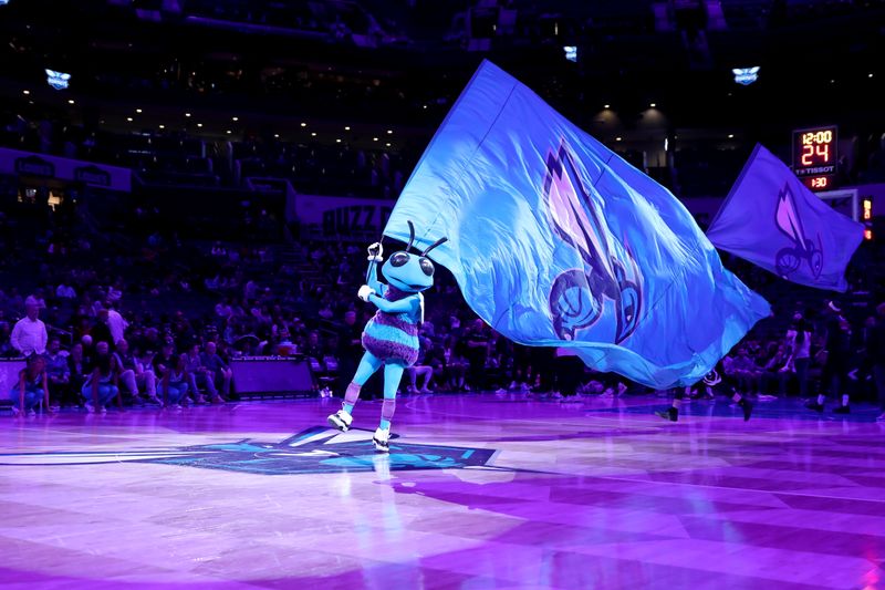 CHARLOTTE, NC - FEBRUARY 15: The Charlotte Hornets mascot, Hugo waves a flag prior to the game against the San Antonio Spurs on February 15, 2023 at Spectrum Center in Charlotte, North Carolina. NOTE TO USER: User expressly acknowledges and agrees that, by downloading and or using this photograph, User is consenting to the terms and conditions of the Getty Images License Agreement.  Mandatory Copyright Notice:  Copyright 2023 NBAE (Photo by Brock Williams-Smith/NBAE via Getty Images)