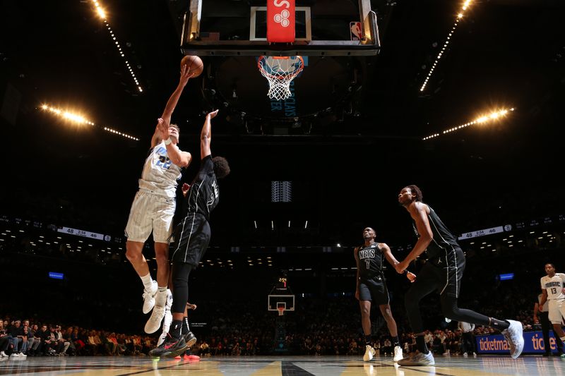 BROOKLYN, NY - NOVEMBER 29: Franz Wagner #22 of the Orlando Magic shoots the ball during the game against the Brooklyn Nets during a Emirates NBA Cup game on October 22, 2024 at Barclays Center in Brooklyn, New York. NOTE TO USER: User expressly acknowledges and agrees that, by downloading and or using this Photograph, user is consenting to the terms and conditions of the Getty Images License Agreement. Mandatory Copyright Notice: Copyright 2024 NBAE (Photo by Nathaniel S. Butler/NBAE via Getty Images)