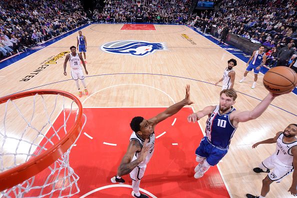 SACRAMENTO, CA - DECEMBER 11: Domantas Sabonis #10 of the Sacramento Kings drives to the basket during the game against the Brooklyn Nets on December 11, 2023 at Golden 1 Center in Sacramento, California. NOTE TO USER: User expressly acknowledges and agrees that, by downloading and or using this Photograph, user is consenting to the terms and conditions of the Getty Images License Agreement. Mandatory Copyright Notice: Copyright 2023 NBAE (Photo by Rocky Widner/NBAE via Getty Images)