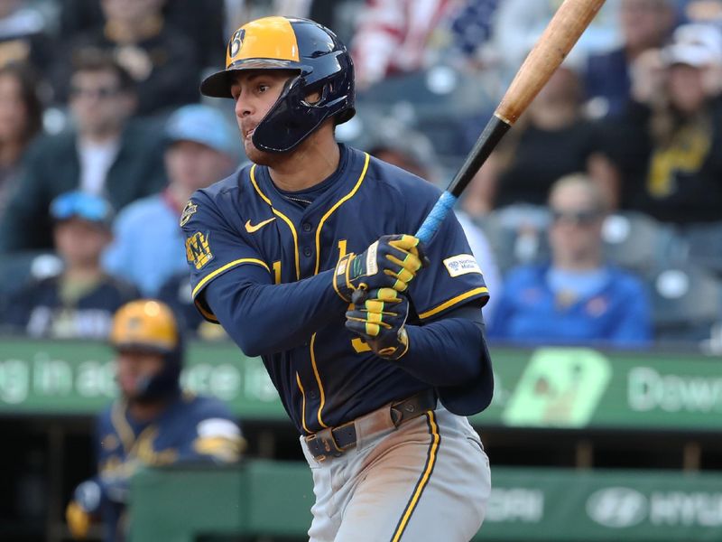 May 24, 2025; Pittsburgh, Pennsylvania, USA;  Milwaukee Brewers shortstop Joey Ortiz (3) hits a single against the Pittsburgh Pirates during the ninth inning at PNC Park. Mandatory Credit: Charles LeClaire-Imagn Images