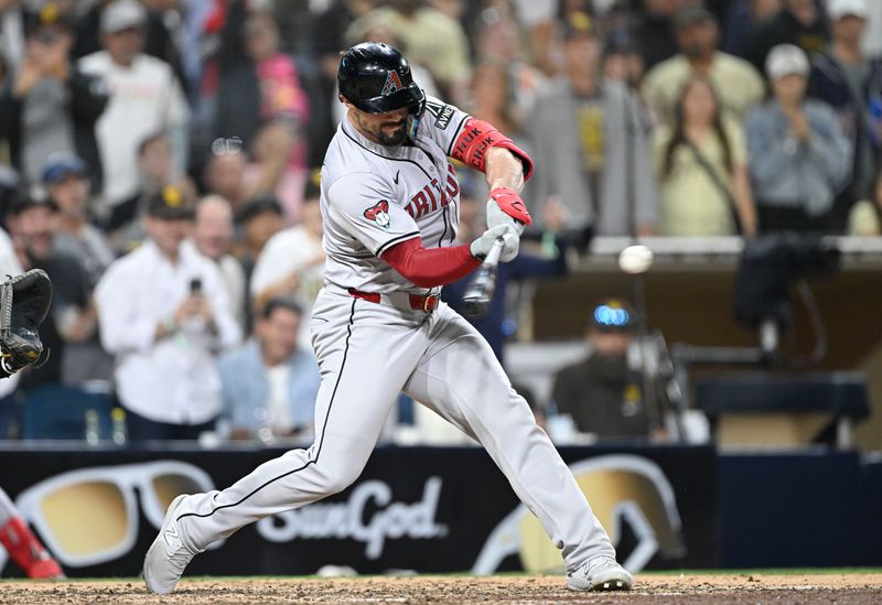 July 5, 2024; San Diego, California, USA; Arizona Diamondbacks right fielder Randal Grichuk (15) hits a two-run home run during the ninth inning against the San Diego Padres at Petco Park. Mandatory Credit: Denis Poroy-USA TODAY Sports