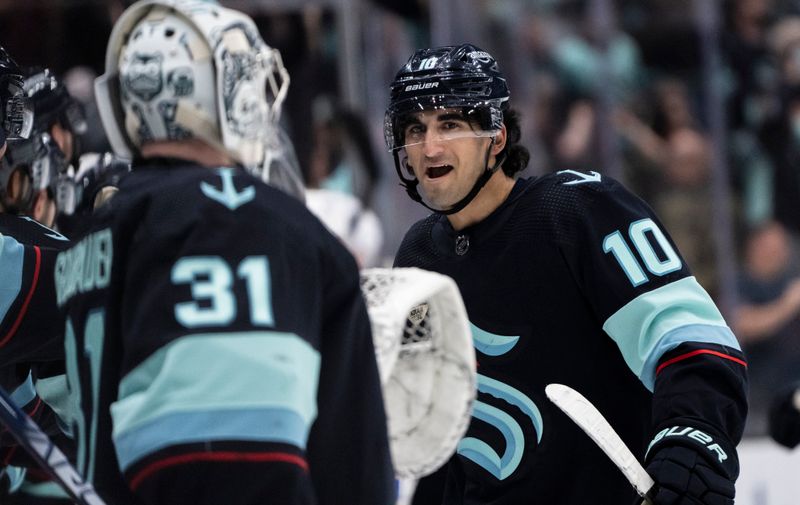 Mar 18, 2024; Seattle, Washington, USA; Seattle Kraken forward Matty Beniers (10) celebrates after scoring a goal during the first period against the Buffalo Sabres at Climate Pledge Arena. Mandatory Credit: Stephen Brashear-USA TODAY Sports