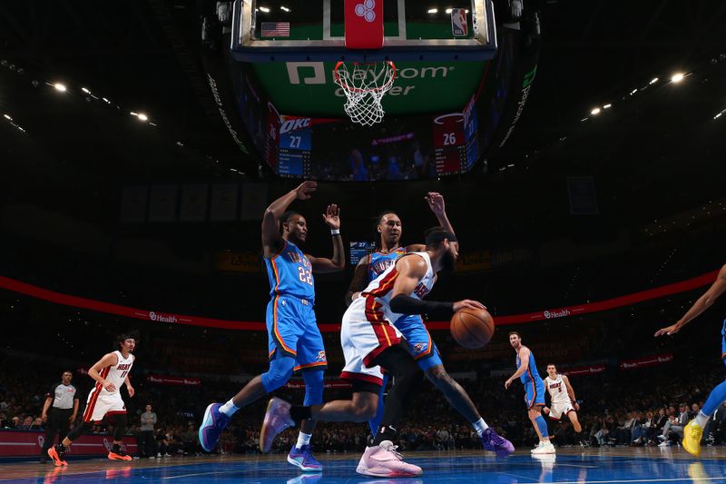 OKLAHOMA CITY, OK - MARCH 8:  Caleb Martin #16 of the Miami Heat handles the ball during the game against the Oklahoma City Thunder on March 8, 2024 at Paycom Arena in Oklahoma City, Oklahoma. NOTE TO USER: User expressly acknowledges and agrees that, by downloading and or using this photograph, User is consenting to the terms and conditions of the Getty Images License Agreement. Mandatory Copyright Notice: Copyright 2024 NBAE (Photo by Zach Beeker/NBAE via Getty Images)