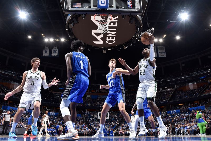 ORLANDO, FL - APRIL 14: Khris Middleton #22 of the Milwaukee Bucks handles the ball during the game against the Orlando Magic on April 14, 2024 at Kia Center in Orlando, Florida. NOTE TO USER: User expressly acknowledges and agrees that, by downloading and or using this photograph, User is consenting to the terms and conditions of the Getty Images License Agreement. Mandatory Copyright Notice: Copyright 2024 NBAE (Photo by Fernando Medina/NBAE via Getty Images)