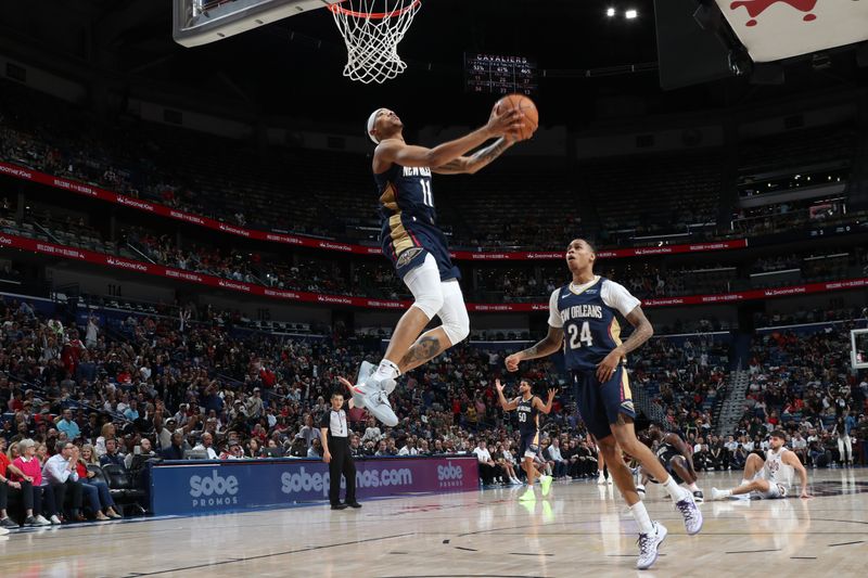 NEW ORLEANS, LA - NOVEMBER 6: Jalen Crutcher #11 of the New Orleans Pelicans dunks the ball during the game against the Cleveland Cavaliers on November 6, 2024 at the Smoothie King Center in New Orleans, Louisiana. NOTE TO USER: User expressly acknowledges and agrees that, by downloading and or using this Photograph, user is consenting to the terms and conditions of the Getty Images License Agreement. Mandatory Copyright Notice: Copyright 2024 NBAE (Photo by Layne Murdoch Jr./NBAE via Getty Images)