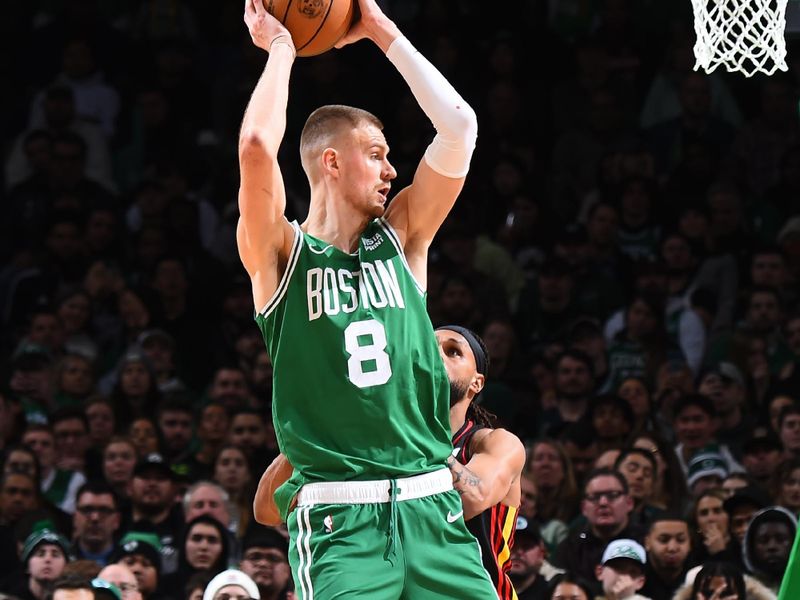 BOSTON, MA - FEBRUARY 7: Kristaps Porzingis #8 of the Boston Celtics looks to pass the ball during the game against the Atlanta Hawks on February 7, 2024 at the TD Garden in Boston, Massachusetts. NOTE TO USER: User expressly acknowledges and agrees that, by downloading and or using this photograph, User is consenting to the terms and conditions of the Getty Images License Agreement. Mandatory Copyright Notice: Copyright 2024 NBAE  (Photo by Brian Babineau/NBAE via Getty Images)