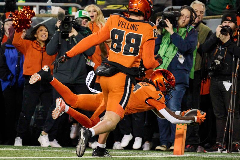 Nov 24, 2023; Eugene, Oregon, USA; Oregon State Beavers wide receiver Silas Bolden (7) scores a touchdown during the first half against the Oregon Ducks at Autzen Stadium. Mandatory Credit: Troy Wayrynen-USA TODAY Sports