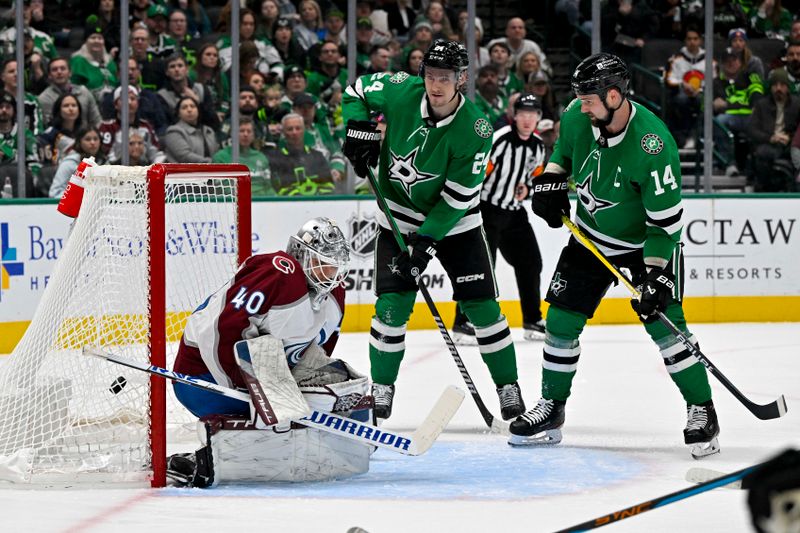 Jan 4, 2024; Dallas, Texas, USA; Dallas Stars center Roope Hintz (24) and left wing Jamie Benn (14) look as a shot by center Joe Pavelski (not pictured) gets past Colorado Avalanche goaltender Alexandar Georgiev (40) during a power play during the second period at the American Airlines Center. Mandatory Credit: Jerome Miron-USA TODAY Sports