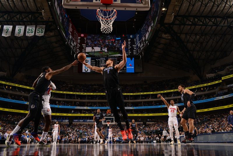 DALLAS, TX - APRIL 12: Dwight Powell #7 of the Dallas Mavericks grabs the rebound during the game against the Detroit Pistons on April 12, 2024 at the American Airlines Center in Dallas, Texas. NOTE TO USER: User expressly acknowledges and agrees that, by downloading and or using this photograph, User is consenting to the terms and conditions of the Getty Images License Agreement. Mandatory Copyright Notice: Copyright 2024 NBAE (Photo by Glenn James/NBAE via Getty Images)