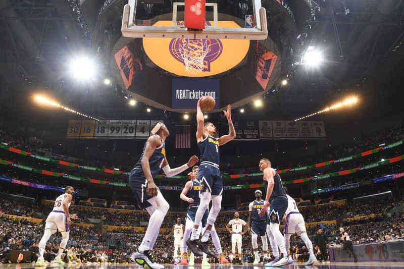 LOS ANGELES, CA - APRIL 27: Michael Porter Jr. #1 of the Denver Nuggets rebounds the ball during the game against the Los Angeles Lakers during Round 1 Game 4 of the 2024 NBA Playoffs on April 27, 2024 at Crypto.Com Arena in Los Angeles, California. NOTE TO USER: User expressly acknowledges and agrees that, by downloading and/or using this Photograph, user is consenting to the terms and conditions of the Getty Images License Agreement. Mandatory Copyright Notice: Copyright 2024 NBAE (Photo by Andrew D. Bernstein/NBAE via Getty Images)