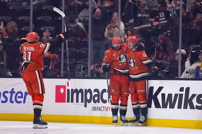 Nov 22, 2024; Anaheim, California, USA; Anaheim Ducks defenseman Drew Helleson (43) celebrates his goal scored against the Buffalo Sabres with left wing Alex Killorn (17) and center Leo Carlsson (91) during the first period at Honda Center. Mandatory Credit: Ryan Sun-Imagn Images