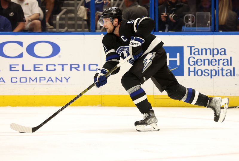 Apr 17, 2024; Tampa, Florida, USA; Tampa Bay Lightning center Steven Stamkos (91) skates with the puck against the Toronto Maple Leafs during the second period at Amalie Arena. Mandatory Credit: Kim Klement Neitzel-USA TODAY Sports