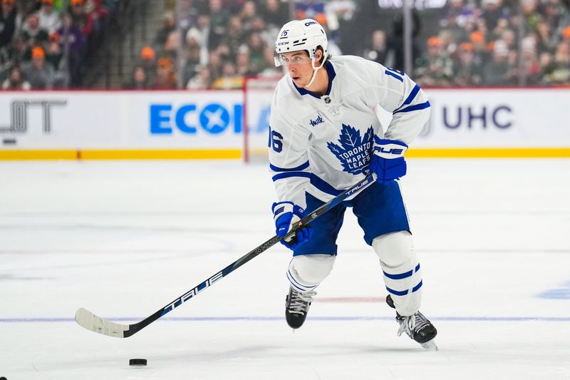 Nov 3, 2024; Saint Paul, Minnesota, USA; Toronto Maple Leafs right wing Mitch Marner (16) looks to pass during the first period against the Minnesota Wild at Xcel Energy Center. Mandatory Credit: Brace Hemmelgarn-Imagn Images