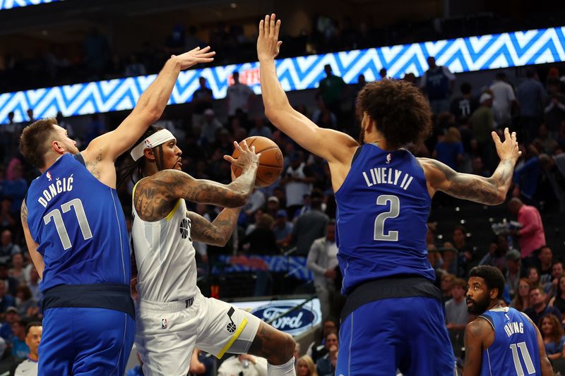 DALLAS, TEXAS - OCTOBER 28: Luka Doncic #77 of the Dallas Mavericks and Dereck Lively II #2 of the Dallas Mavericks defend against a shot by Jordan Clarkson #00 of the Utah Jazz in the second half of a game at American Airlines Center on October 28, 2024 in Dallas, Texas. NOTE TO USER: User expressly acknowledges and agrees that, by downloading and or using this photograph, User is consenting to the terms and conditions of the Getty Images License Agreement. (Photo by Richard Rodriguez/Getty Images)