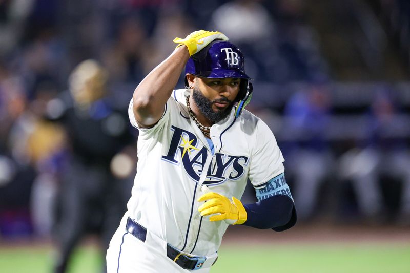Jun 3, 2025; Tampa, Florida, USA; Tampa Bay Rays third baseman Junior Caminero (13) runs the bases after hitting a solo home run against the Texas Rangers in the eighth inning at George M. Steinbrenner Field. Mandatory Credit: Nathan Ray Seebeck-Imagn Images