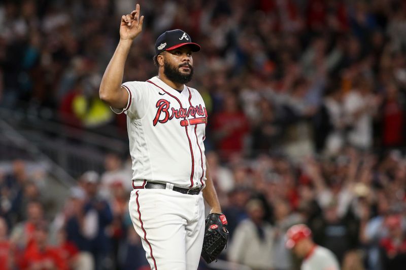 Oct 12, 2022; Atlanta, Georgia, USA; Atlanta Braves relief pitcher Kenley Jansen (74) points skyward on a ball hit for the final out against the Philadelphia Phillies in the ninth inning during game two of the NLDS for the 2022 MLB Playoffs at Truist Park. Mandatory Credit: Brett Davis-USA TODAY Sports