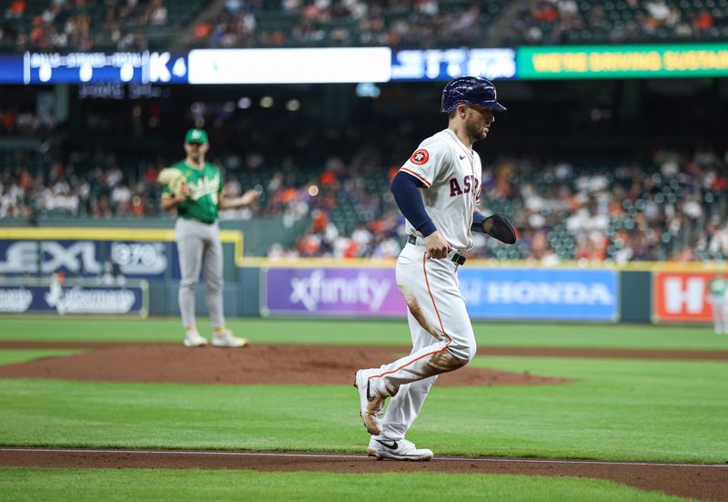 May 16, 2024; Houston, Texas, USA; Oakland Athletics relief pitcher Hogan Harris (63) reacts and Houston Astros third baseman Alex Bregman (2) scores a run from third base after a balk call during the fourth inning at Minute Maid Park. Mandatory Credit: Troy Taormina-USA TODAY Sports