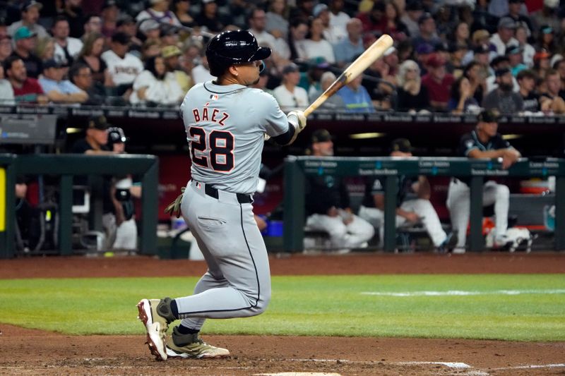 May 17, 2024; Phoenix, Arizona, USA; Detroit Tigers shortstop Javier Báez (28) hits a two-run double against the Arizona Diamondbacks in the fifth inning at Chase Field. Mandatory Credit: Rick Scuteri-USA TODAY Sports