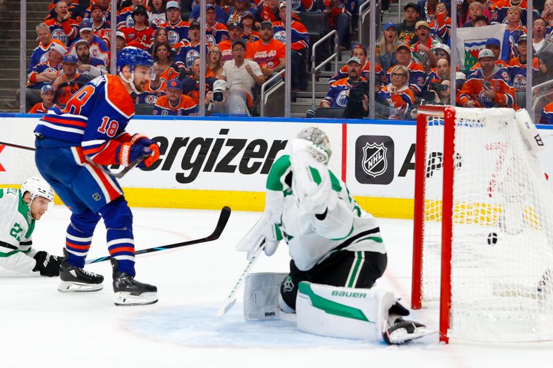 May 25, 2025; Edmonton, Alberta, CAN; Edmonton Oilers left wing Zach Hyman (18) scores a goal against Dallas Stars goaltender Jake Oettinger (29) during the third period in game three of the Western Conference Final of the 2025 Stanley Cup Playoffs at Rogers Place. Mandatory Credit: Perry Nelson-Imagn Images