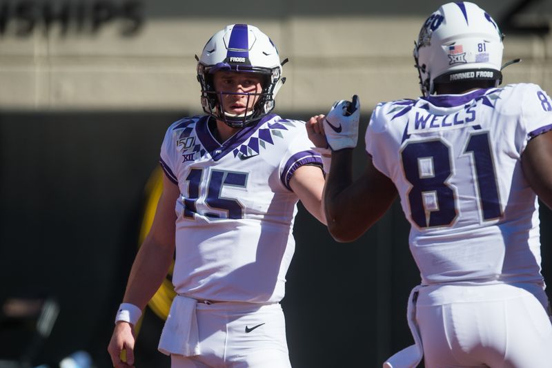 Nov 2, 2019; Stillwater, OK, USA; TCU Horned Frogs quarterback Max Duggan (15) bumps fists with tight end Pro Wells (81) before a game against the Oklahoma State Cowboys at Boone Pickens Stadium. Mandatory Credit: Brett Rojo-USA TODAY Sports