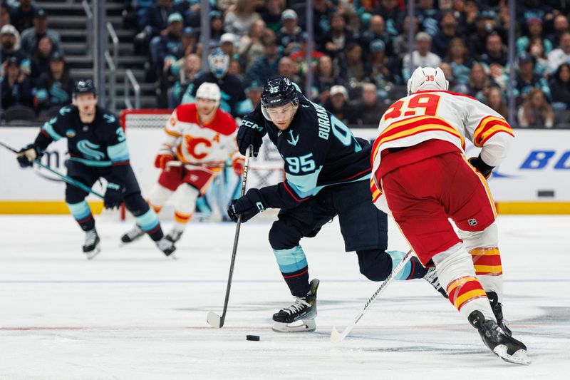 Oct 19, 2024; Seattle, Washington, USA; Seattle Kraken left wing Andre Burakovsky (95) skates against Calgary Flames right wing Anthony Mantha (39) during the third period at Climate Pledge Arena. Mandatory Credit: Caean Couto-Imagn Images