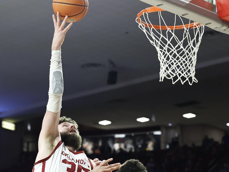 Feb 11, 2023; Norman, Oklahoma, USA; Oklahoma Sooners forward Tanner Groves (35) shoots over Kansas Jayhawks guard Kevin McCullar Jr. (15) during the second half at Lloyd Noble Center. Kansas won 78-55. Mandatory Credit: Alonzo Adams-USA TODAY Sports