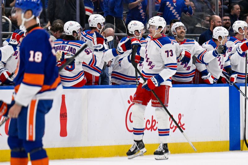 Feb 25, 2025; Elmont, New York, USA;  New York Rangers center Matt Rempe (73) celebrates his goal against the New York Islanders during the second period at UBS Arena. Mandatory Credit: Dennis Schneidler-Imagn Images