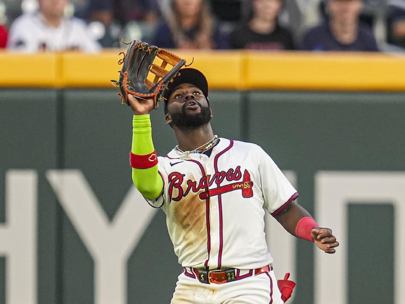 May 20, 2024; Cumberland, Georgia, USA; Atlanta Braves center fielder Michael Harris II (23) catches a fly ball hit by San Diego Padres first baseman Jake Cronenworth (9) (not shown) during the eighth inning at Truist Park.Mandatory Credit: Dale Zanine-USA TODAY Sports