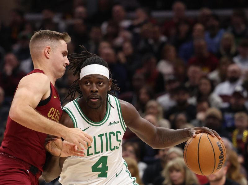 CLEVELAND, OH - DECEMBER 1: Jrue Holiday #4 of the Boston Celtics dribbles the ball during the game against the Cleveland Cavaliers on December 1, 2024 at Rocket Mortgage FieldHouse in Cleveland, Ohio. NOTE TO USER: User expressly acknowledges and agrees that, by downloading and/or using this Photograph, user is consenting to the terms and conditions of the Getty Images License Agreement. Mandatory Copyright Notice: Copyright 2024 NBAE (Photo by  Lauren Leigh Bacho/NBAE via Getty Images)