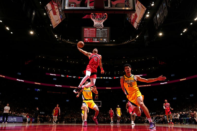 TORONTO, CANADA - FEBRUARY 14: Bruce Brown #11 of the Toronto Raptors dunks the ball during the game against the Indiana Pacers on February 14, 2024 at the Scotiabank Arena in Toronto, Ontario, Canada.  NOTE TO USER: User expressly acknowledges and agrees that, by downloading and or using this Photograph, user is consenting to the terms and conditions of the Getty Images License Agreement.  Mandatory Copyright Notice: Copyright 2024 NBAE (Photo by Mark Blinch/NBAE via Getty Images)