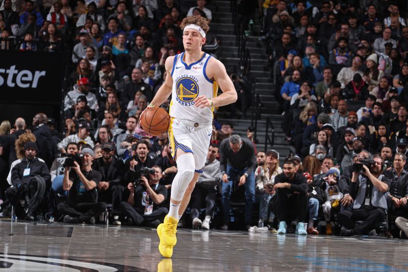 BROOKLYN, NY - FEBRUARY 5: Brandin Podziemski #2 of the Golden State Warriors dribbles the ball during the game against the Brooklyn Nets on February 5, 2024 at Barclays Center in Brooklyn, New York. NOTE TO USER: User expressly acknowledges and agrees that, by downloading and or using this Photograph, user is consenting to the terms and conditions of the Getty Images License Agreement. Mandatory Copyright Notice: Copyright 2024 NBAE (Photo by Nathaniel S. Butler/NBAE via Getty Images)