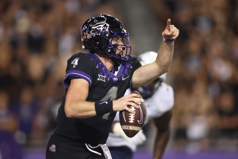 Sep 30, 2023; Fort Worth, Texas, USA; TCU Horned Frogs quarterback Chandler Morris (4) rolls out to pass against West Virginia Mountaineers defensive lineman Tomiwa Durojaiye (3) in the second quarter at Amon G. Carter Stadium. Mandatory Credit: Tim Heitman-USA TODAY Sports