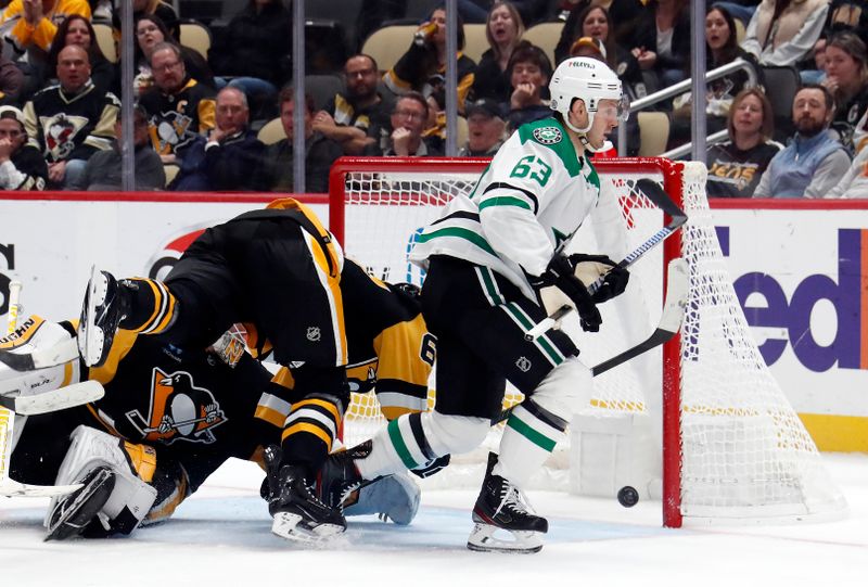 Oct 24, 2023; Pittsburgh, Pennsylvania, USA; Dallas Stars right wing Evgenii Dadonov (63) scores a goal against the Pittsburgh Penguins during the second period at PPG Paints Arena. Dallas won 4-1. Mandatory Credit: Charles LeClaire-USA TODAY Sports