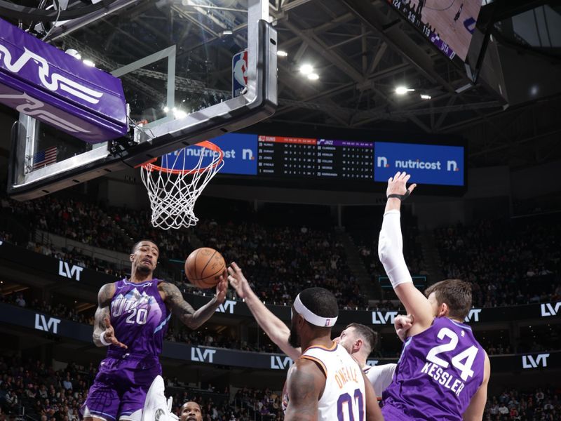 SALT LAKE CITY, UT - DECEMBER 13: John Collins #20 of the Utah Jazz drives to the basket during the game against the Phoenix Suns   during a regular season game on December 13, 2024 at Delta Center in Salt Lake City, Utah. NOTE TO USER: User expressly acknowledges and agrees that, by downloading and or using this Photograph, User is consenting to the terms and conditions of the Getty Images License Agreement. Mandatory Copyright Notice: Copyright 2024 NBAE (Photo by Melissa Majchrzak/NBAE via Getty Images)